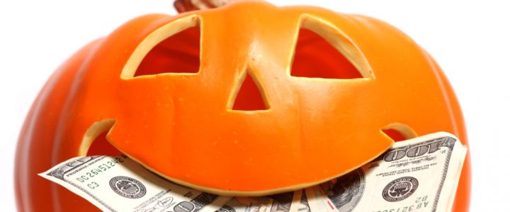 Halloween pumpkin with US dollar bills