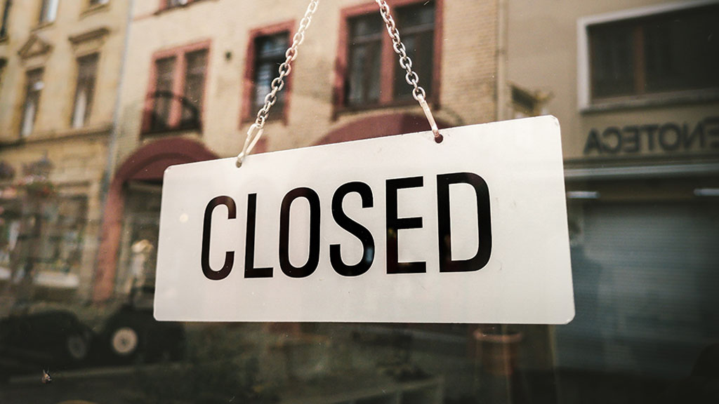 Front door sign of a closed business