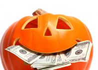 Halloween pumpkin with US dollar bills